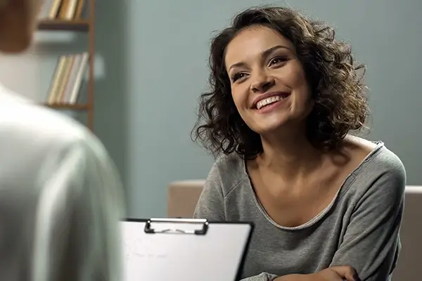 A patient smiling at a doctor