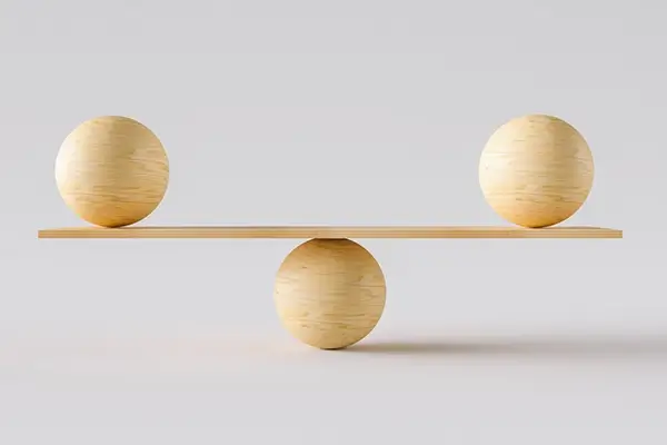 A balance scale made of wooden objects