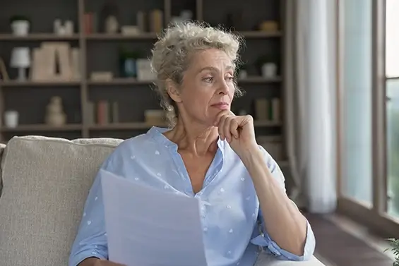 A woman looking out the window deep in thought