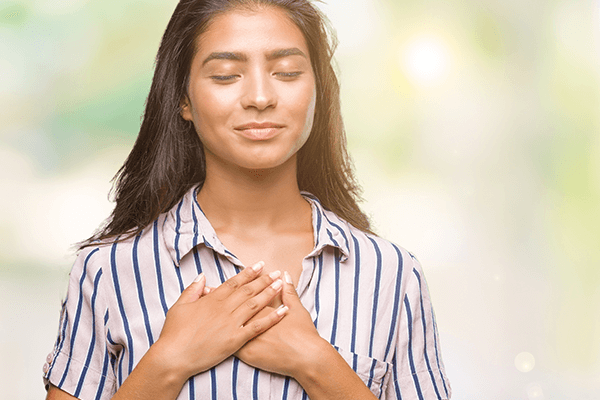 A woman looking happy and at peace