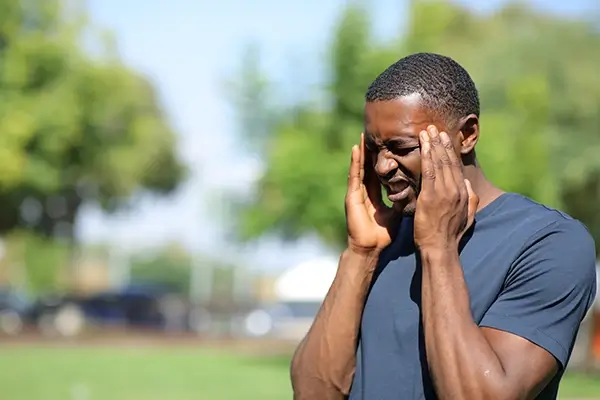 A man rubbing his temples